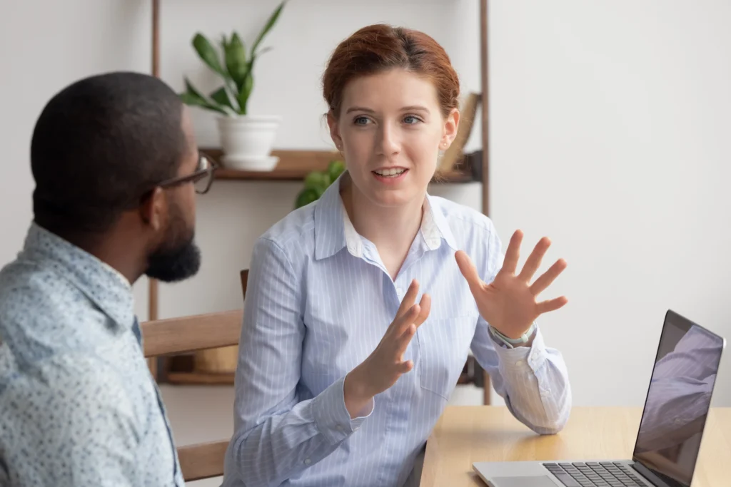 Sales coach teaching assumptive language techniques to improve the sales process.