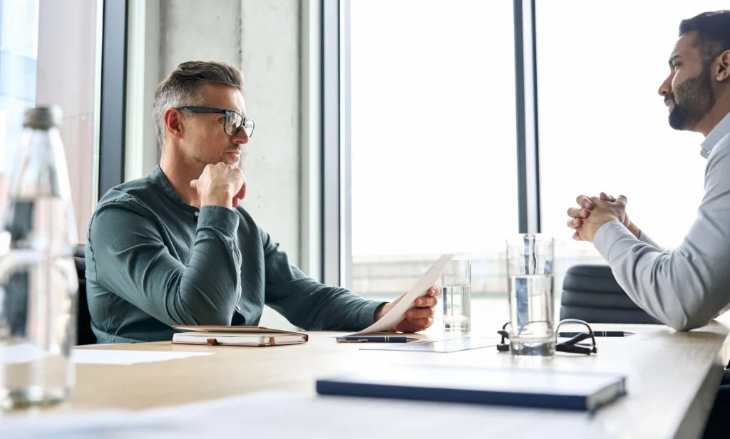 Sales professional using business coaching techniques to improve sales strategies.